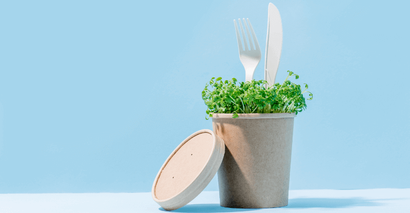 compostable packaging with cress growing out of it.