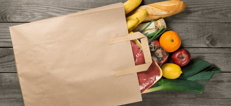 paper packaging shopping bag with food inside