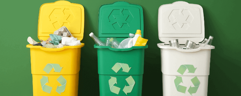 three recycling bins