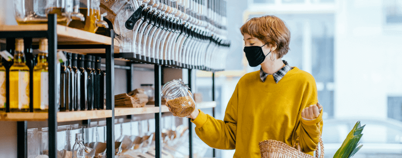 a woman shopping sustainably